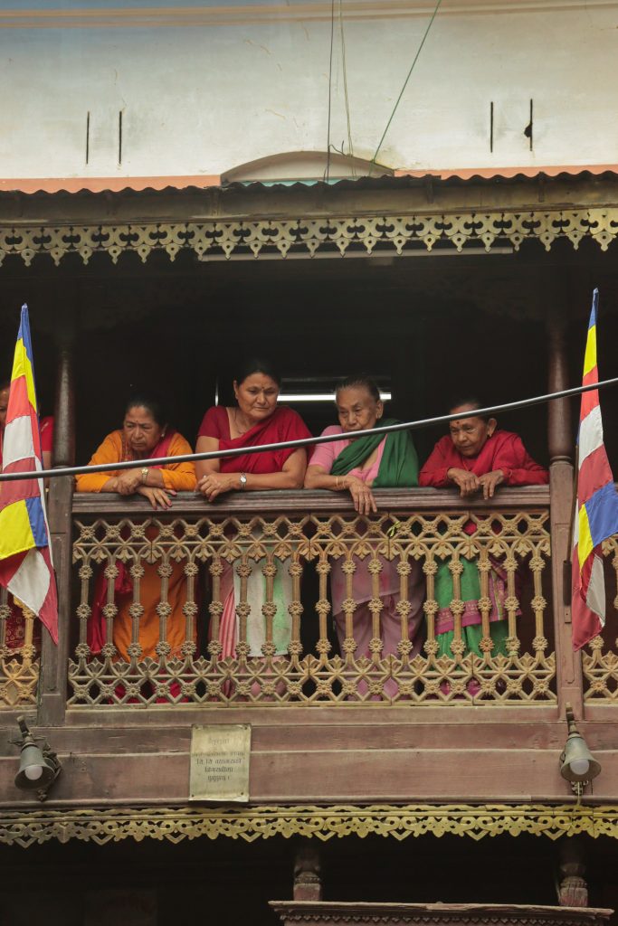4 nepali women standing on balcony